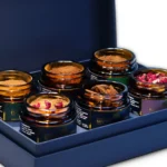Fragrant spices in jars from the D.E.Collection Gourmet Sweets & Coffee set, close-up.