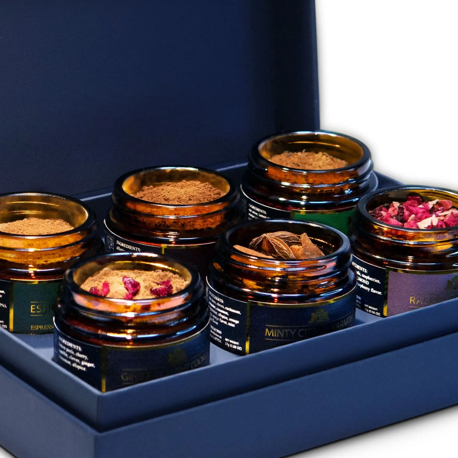 Fragrant spices in jars from the D.E.Collection Gourmet Sweets & Coffee set, close-up.